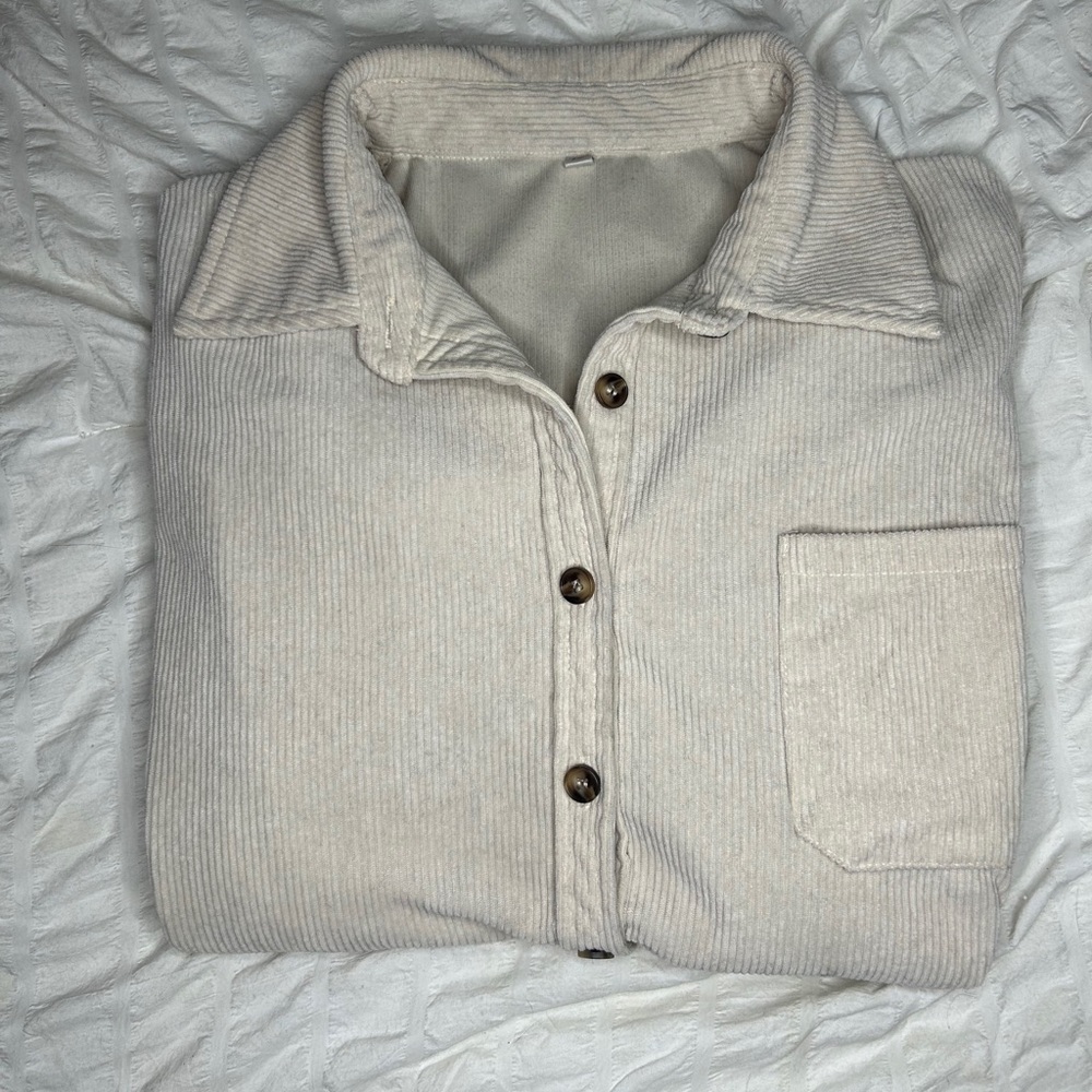 Beige corduroy jacket- few black paint stains inside right cuff